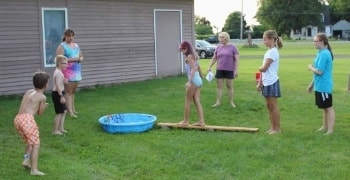 Kids and adults playing outdoor games together at VBS